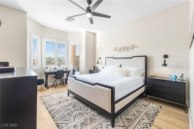 10504 Button Willow Dr, Las Vegas, NV 89134 - bedroom with a desk, light wood-style flooring, and a ceiling fan