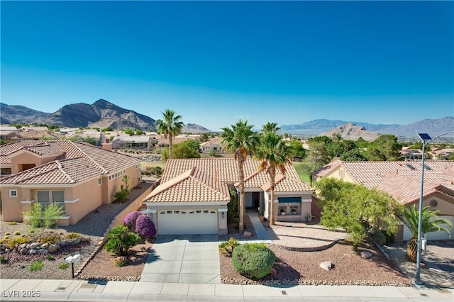 10504 Button Willow Dr, Las Vegas, NV 89134 - mediterranean / spanish-style house with an attached garage, a mountain view, stucco siding, and concrete driveway