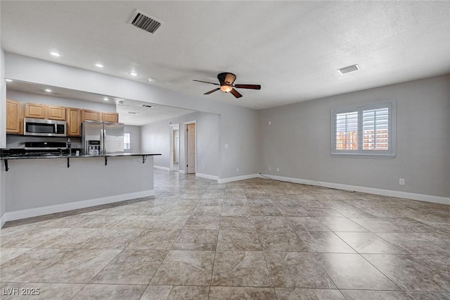 839 Benita Pl, Boulder City, NV 89005 - unfurnished living room with plenty of natural light, baseboards, a ceiling fan, and recessed lighting