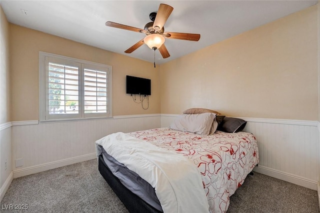 839 Benita Pl, Boulder City, NV 89005 - bedroom with wainscoting, carpet, and a ceiling fan