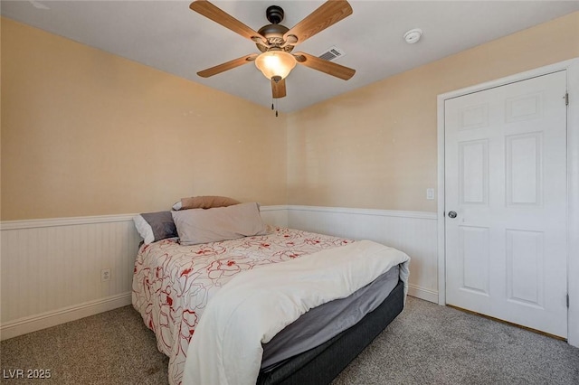 839 Benita Pl, Boulder City, NV 89005 - bedroom featuring a wainscoted wall, carpet floors, and ceiling fan