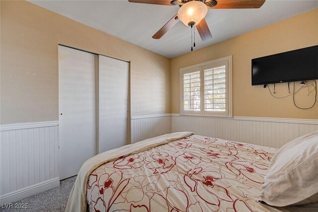 839 Benita Pl, Boulder City, NV 89005 - bedroom featuring wainscoting, a closet, carpet floors, and ceiling fan