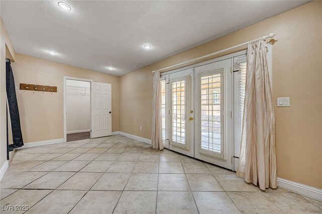 839 Benita Pl, Boulder City, NV 89005 - empty room with french doors, light tile patterned floors, baseboards, and recessed lighting