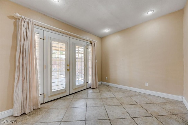 839 Benita Pl, Boulder City, NV 89005 - spare room featuring baseboards, light tile patterned floors, french doors, and recessed lighting
