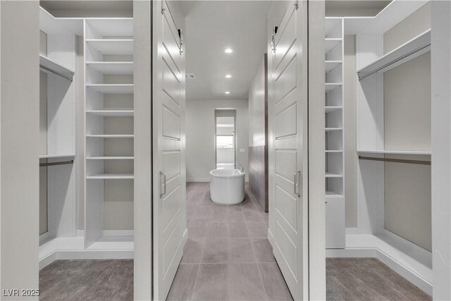 5364 Succulent Rose Dr, Las Vegas, NV 89135 - spacious closet featuring light tile patterned floors