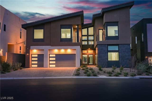 5364 Succulent Rose Dr, Las Vegas, NV 89135 - contemporary house with a garage, stucco siding, driveway, and stone siding