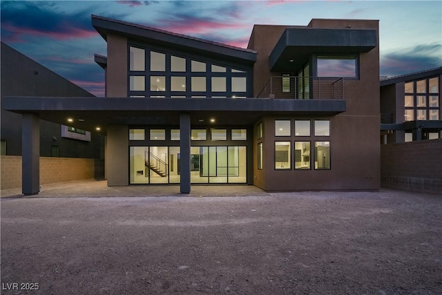 5364 Succulent Rose Dr, Las Vegas, NV 89135 - rear view of house with stairway and stucco siding