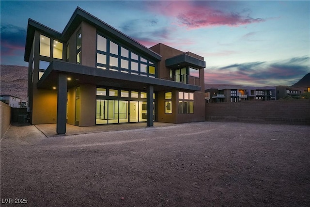 5364 Succulent Rose Dr, Las Vegas, NV 89135 - back of property with stucco siding and a balcony
