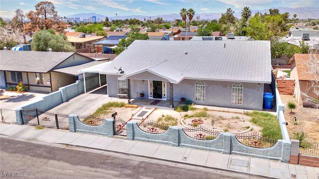 1112 Sandy Cove St, Las Vegas, NV 89110 - single story home featuring stucco siding, a fenced front yard, driveway, roof with shingles, and a gate
