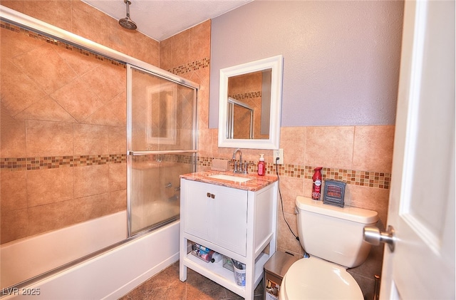 1112 Sandy Cove St, Las Vegas, NV 89110 - bathroom with toilet, a combined bath / shower with rainfall shower, tile walls, and vanity
