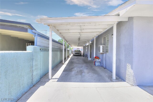 1112 Sandy Cove St, Las Vegas, NV 89110 - view of parking featuring a carport and concrete driveway