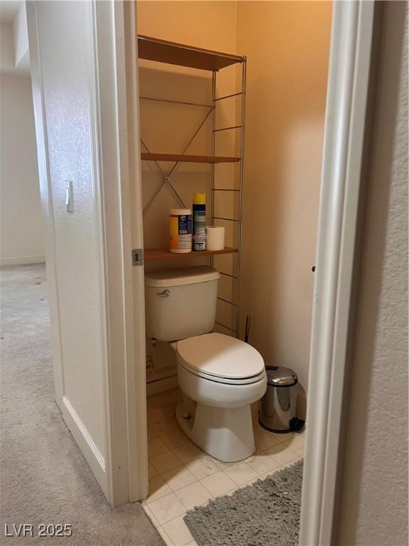87 E Agate Ave Unit 202, Las Vegas, NV 89123 - bathroom featuring toilet and tile patterned flooring