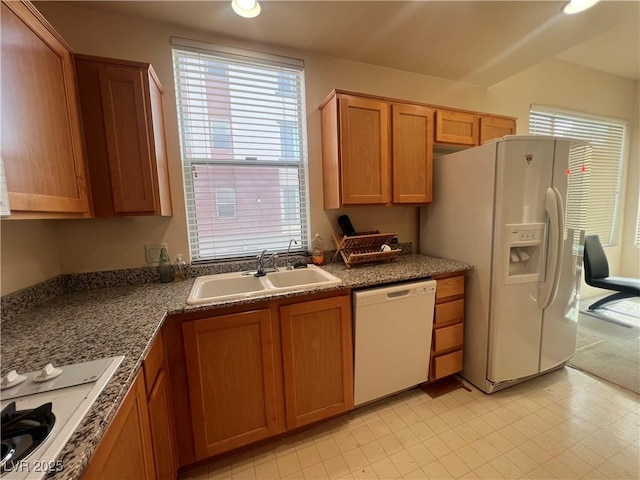 87 E Agate Ave Unit 202, Las Vegas, NV 89123 - kitchen with white appliances, a sink, brown cabinets, recessed lighting, and dark countertops