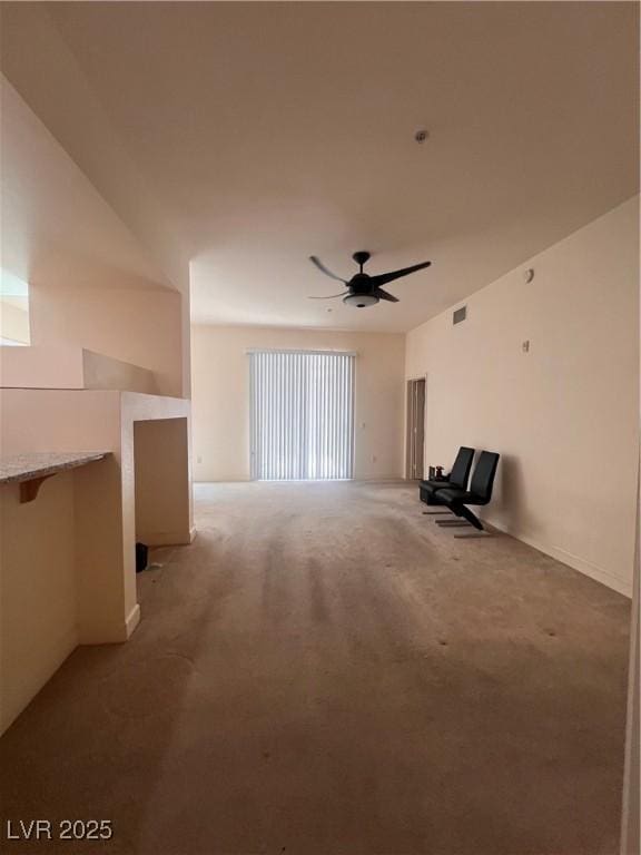 87 E Agate Ave Unit 202, Las Vegas, NV 89123 - unfurnished living room featuring light carpet and ceiling fan