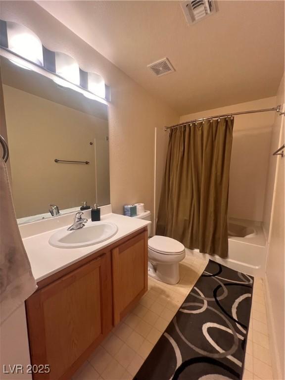 87 E Agate Ave Unit 202, Las Vegas, NV 89123 - bathroom with tile patterned flooring, toilet, vanity, and shower / bathtub combination with curtain