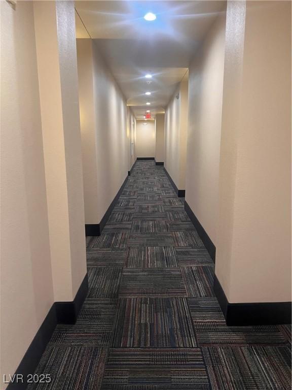 87 E Agate Ave Unit 202, Las Vegas, NV 89123 - hallway featuring baseboards, dark carpet, and recessed lighting
