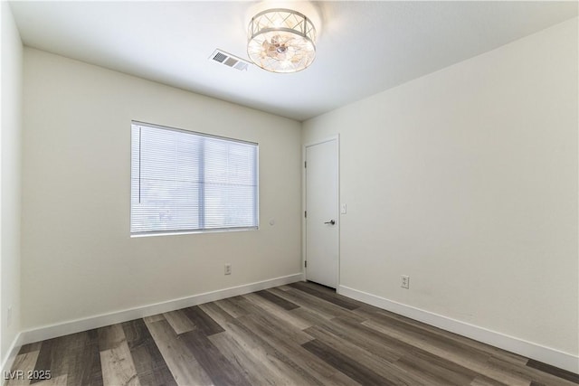 10162 Lemon Thyme St, Las Vegas, NV 89183 - unfurnished room featuring dark wood-type flooring and baseboards