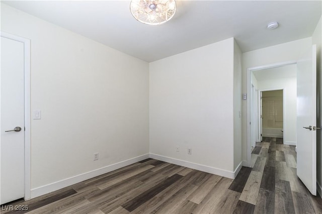 10162 Lemon Thyme St, Las Vegas, NV 89183 - empty room featuring wood finished floors, a smoke detector, and baseboards