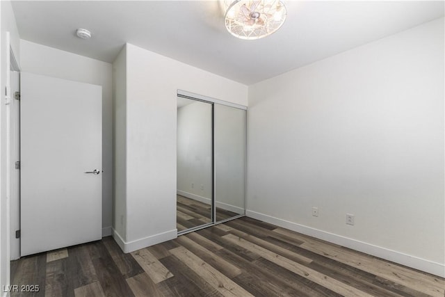 10162 Lemon Thyme St, Las Vegas, NV 89183 - unfurnished bedroom featuring wood finished floors, baseboards, and a closet