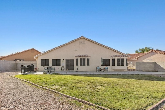 1079 Oak Shade Ln, Henderson, NV 89015 - back of house featuring stucco siding and a patio