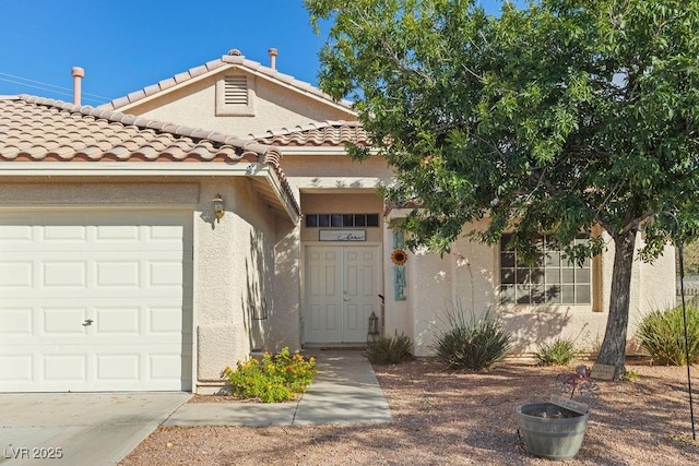 1079 Oak Shade Ln, Henderson, NV 89015 - view of front of house featuring an attached garage, stucco siding, and a tile roof