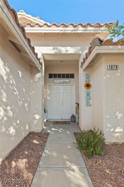 1079 Oak Shade Ln, Henderson, NV 89015 - entrance to property with stucco siding and a tiled roof
