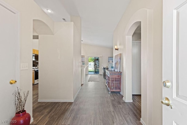 1079 Oak Shade Ln, Henderson, NV 89015 - hall featuring arched walkways, wood finished floors, baseboards, and vaulted ceiling