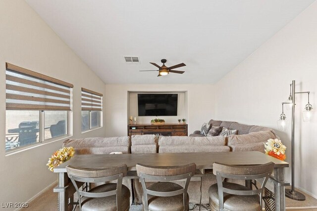 1079 Oak Shade Ln, Henderson, NV 89015 - dining space featuring baseboards, vaulted ceiling, a ceiling fan, and carpet