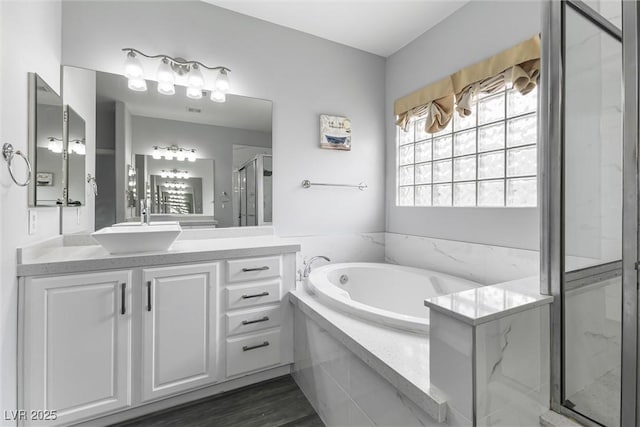 2231 Desert Prairie St, Las Vegas, NV 89135 - bathroom featuring a garden tub, a stall shower, and vanity