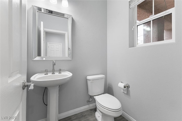 2231 Desert Prairie St, Las Vegas, NV 89135 - half bath with toilet, baseboards, and wood finished floors