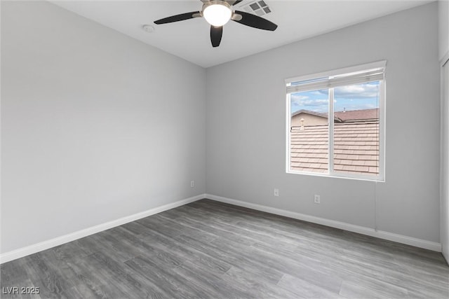 2231 Desert Prairie St, Las Vegas, NV 89135 - unfurnished room with a ceiling fan, wood finished floors, baseboards, and a smoke detector