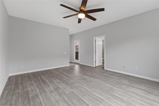2231 Desert Prairie St, Las Vegas, NV 89135 - unfurnished room featuring a ceiling fan, wood finished floors, and baseboards