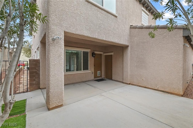 2231 Desert Prairie St, Las Vegas, NV 89135 - entrance to property with stucco siding and a patio area