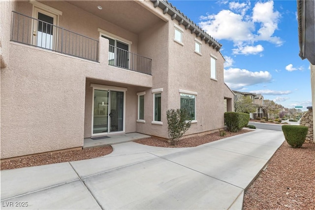 2231 Desert Prairie St, Las Vegas, NV 89135 - exterior space with stucco siding and a patio