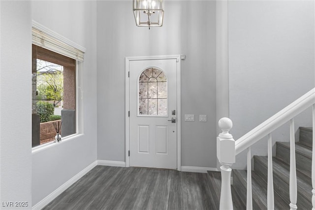 2231 Desert Prairie St, Las Vegas, NV 89135 - foyer featuring dark wood-type flooring, stairway, a chandelier, a high ceiling, and baseboards