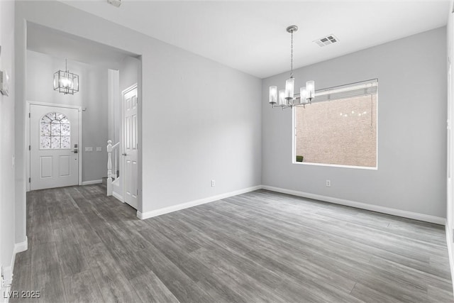 2231 Desert Prairie St, Las Vegas, NV 89135 - unfurnished dining area with a chandelier, wood finished floors, and baseboards