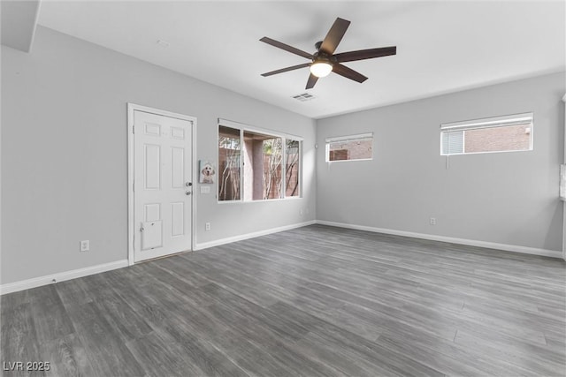 2231 Desert Prairie St, Las Vegas, NV 89135 - empty room with a ceiling fan, dark wood-style flooring, and baseboards