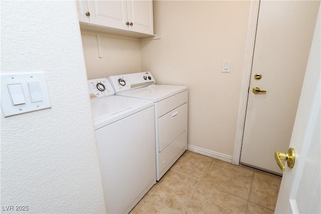 2787 Sunken Ship St, Laughlin, NV 89029 - laundry area with washing machine and dryer, cabinet space, light tile patterned flooring, and baseboards