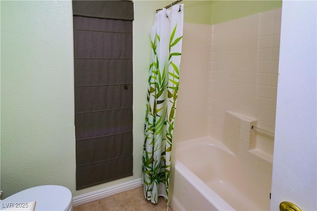 2787 Sunken Ship St, Laughlin, NV 89029 - full bath with toilet, shower / tub combo with curtain, tile patterned floors, and baseboards