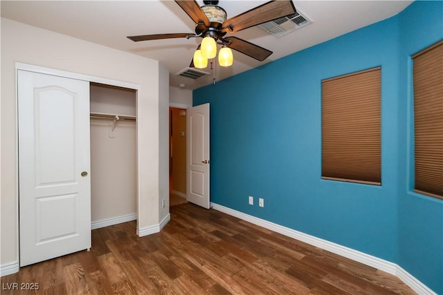 2787 Sunken Ship St, Laughlin, NV 89029 - unfurnished bedroom with baseboards, wood finished floors, ceiling fan, and a closet