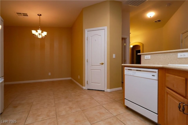 2787 Sunken Ship St, Laughlin, NV 89029 - kitchen with dishwasher, light tile patterned floors, a chandelier, light countertops, and decorative light fixtures