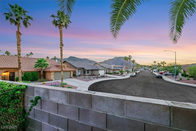 160 Coastal Pier Ct, Henderson, NV 89002 - view of asphalt road featuring a residential view, sidewalks, street lights, curbs, and a mountain view