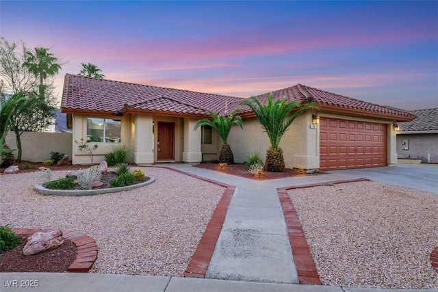 160 Coastal Pier Ct, Henderson, NV 89002 - mediterranean / spanish-style house featuring driveway, stucco siding, a garage, and a tile roof