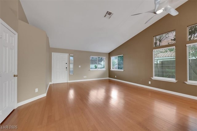 160 Coastal Pier Ct, Henderson, NV 89002 - unfurnished living room with wood finished floors, ceiling fan, high vaulted ceiling, and plenty of natural light