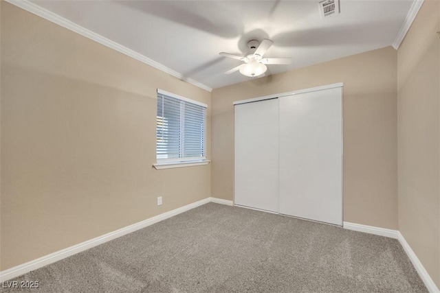 160 Coastal Pier Ct, Henderson, NV 89002 - unfurnished bedroom with carpet flooring, a closet, crown molding, and a ceiling fan