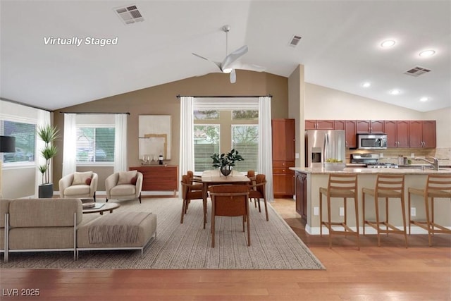 160 Coastal Pier Ct, Henderson, NV 89002 - dining area featuring vaulted ceiling, a ceiling fan, light wood-style floors, and recessed lighting