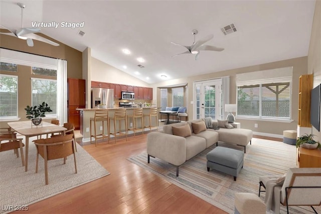 160 Coastal Pier Ct, Henderson, NV 89002 - living room with a ceiling fan, vaulted ceiling, light wood-style flooring, healthy amount of natural light, and recessed lighting