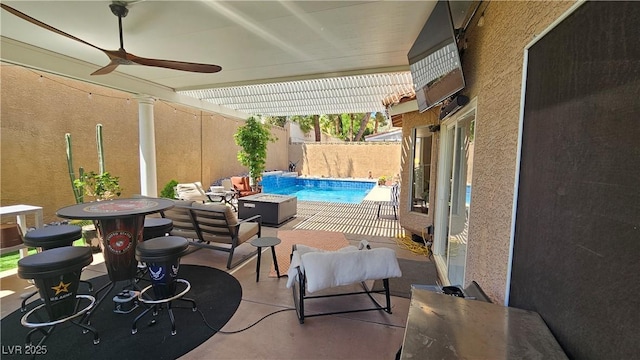 3355 Royal Bay Dr, Las Vegas, NV 89117 - view of patio with a ceiling fan and a fire pit