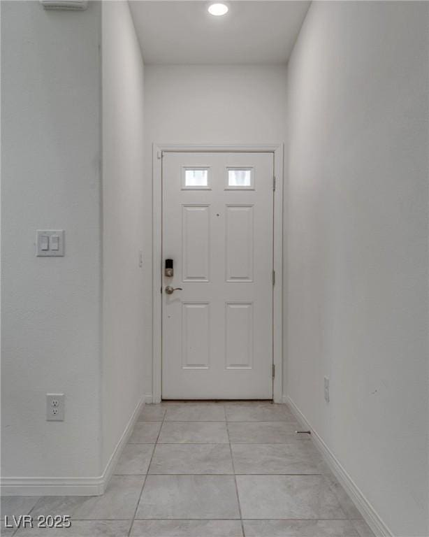 4448 Mahogany Hills Ave, Las Vegas, NV 89141 - doorway to outside featuring baseboards and light tile patterned floors