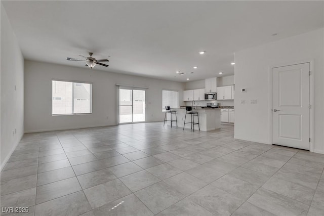 4448 Mahogany Hills Ave, Las Vegas, NV 89141 - unfurnished living room featuring ceiling fan, light tile patterned floors, recessed lighting, and baseboards